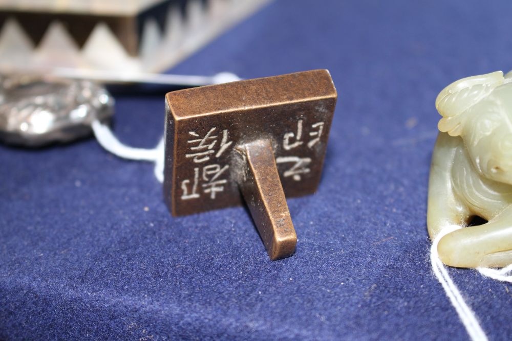 A Chinese bronze inscribed scholars seal, 4cm sq.